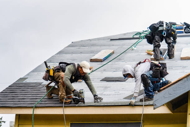 Professional Roofing technician working in Manchester, MA